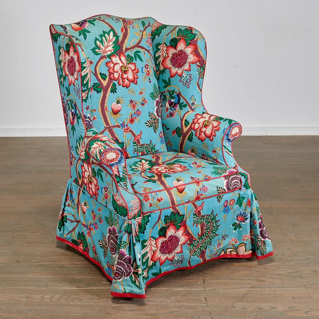 George III Mahogany Upholstered Wing Chair: George III Mahogany Upholstered Wing Chair, c. 1760, of typical form, raised on square tapering legs joined by stretchers, entirely slip-upholstered in blue and red flowered chintz fabric, 45 1/4" h x