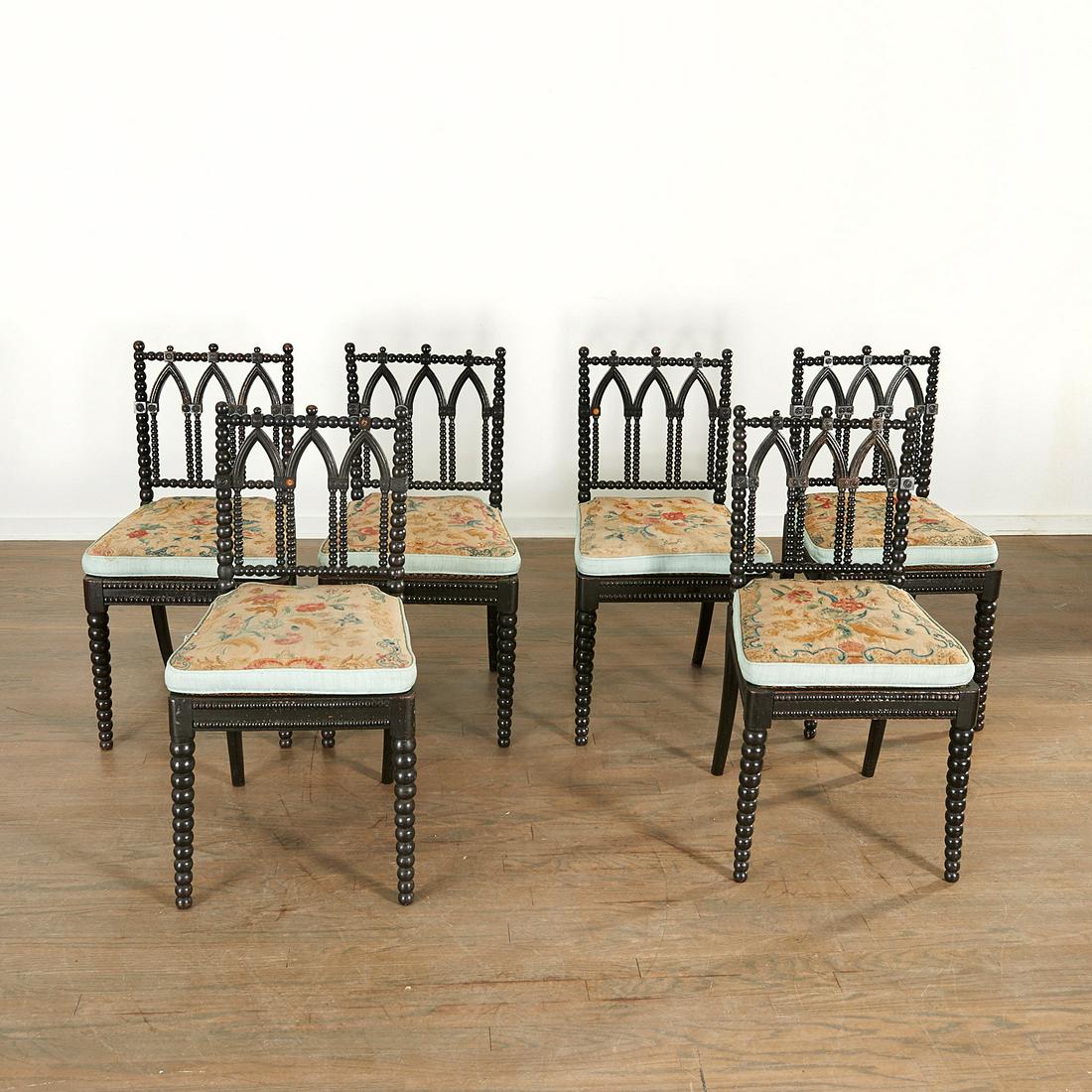 Set (6) Victorian "Gothick" Ebonized Side Chairs: Set (6) Victorian "Gothick" Ebonized Side Chairs, Mid-19th c., with bobbin-turned frames and Gothic arch splats, antique needlepoint cushions, 34" h x 17.5"w Provenance: The Collection of Elizabeth ��