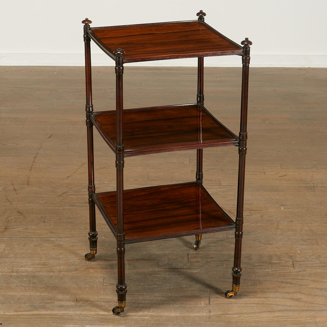 Regency Hardwood Three-Tier Etagere: Regency Hardwood Three-Tier Etagere, c. 1830, the square shelves raised on turned uprights with umbrella finials, 31 3/4" h x 15 1/2" w x 15 1/2" d Provenance: The Collection of Elizabeth “Betty" Se