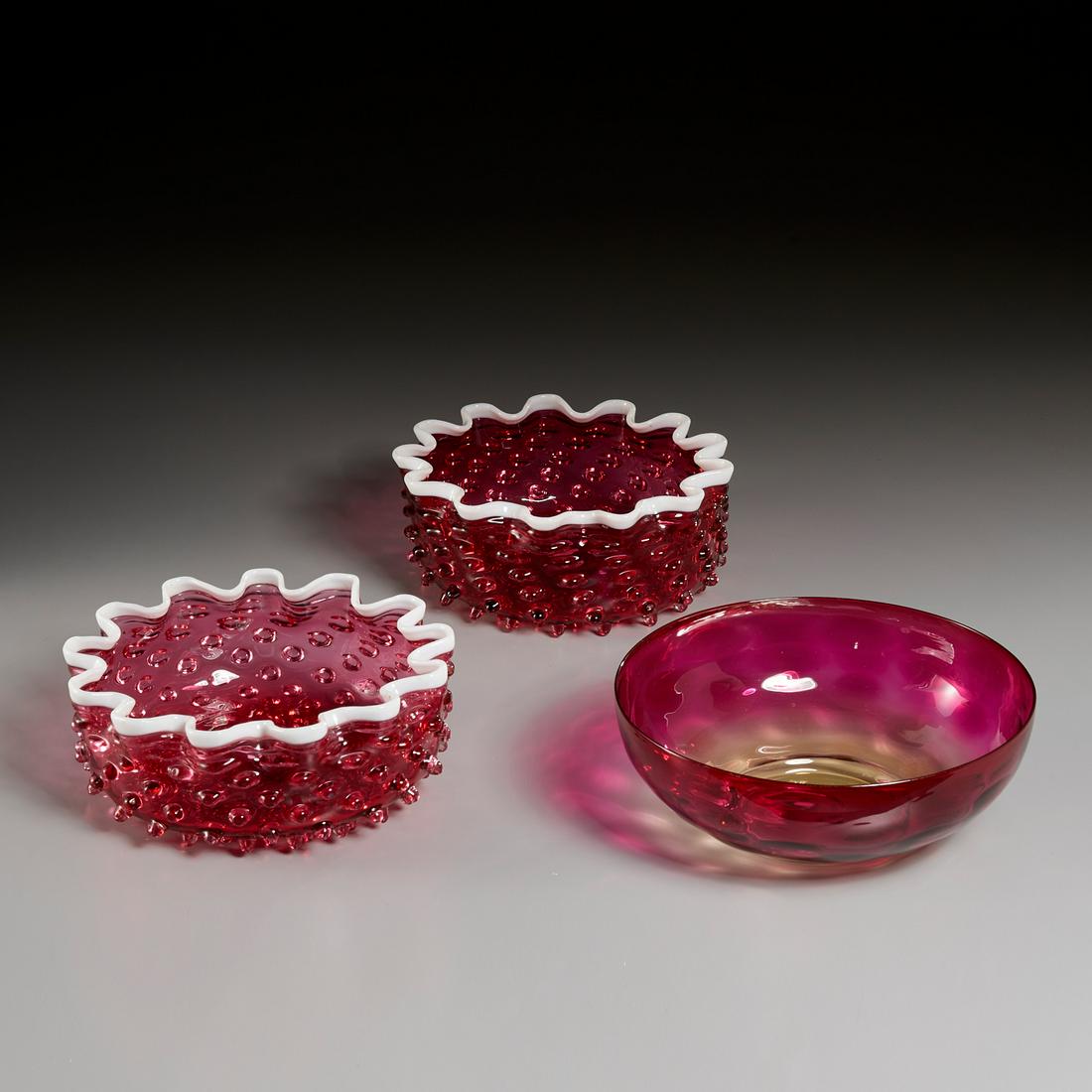 (3) Victorian Art Glass Bowls: (3) Victorian Art Glass Bowls, 19th c., Including: (1) pair of Cranberry glass hobnail bowls with white lip wraps, and (1) quilted Amberina bowl, Amberina bowl: 8 1/4" dia. Provenance: The Collection