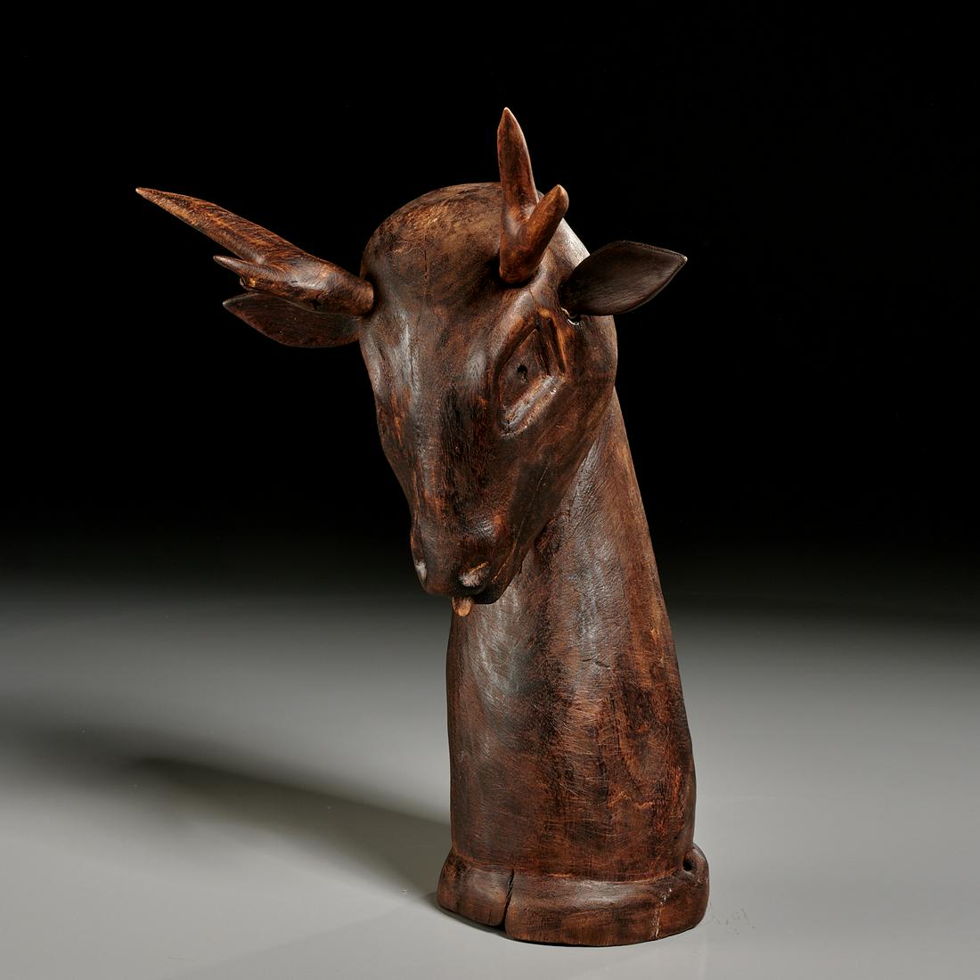 Folk Art carved wood deer trophy: Folk Art carved wood deer trophy, 20th c., carved and stained wood, antlers and ears can be removed, no signature observed, indecipherable label on back, 10"h x 7"w x 4"d
