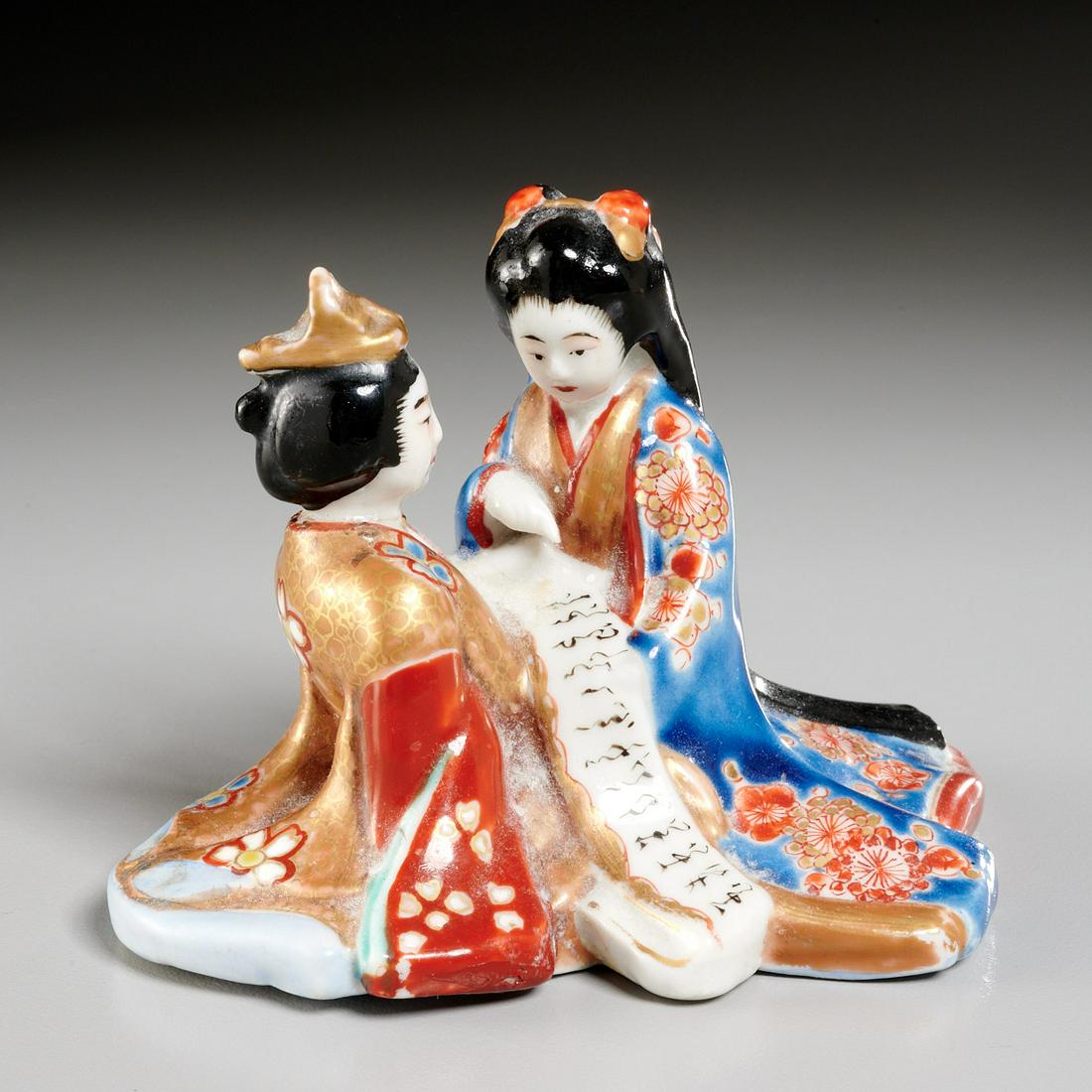 Japanese porcelain erotic figure group: Japanese porcelain erotic figure group, Meiji Period (19th/20th c.), Kutani gilt and polychrome enameled porcelain, modeled as a kneeling bijin and a male figure wearing ornate robes and holding an op