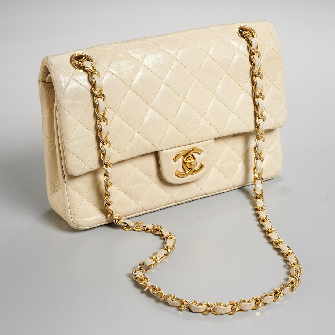 Chanel double flap quilted lambskin handbag: Chanel double flap quilted lambskin handbag, late 20th c., classic style in beige with gold-tone hardware, chain link strap, gold Chanel CC turn-lock clasp, 14" strap drop (at longest), approx. 6"h x 