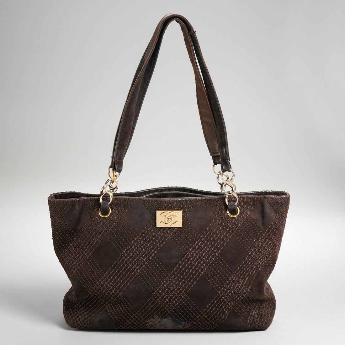 Chanel brown quilted suede tote handbag: Chanel brown quilted suede tote handbag, late 20th c., shoulder bag with double chain & leather handles, interlocking CC hardware, center section with zip pocket, (2) side pockets, with logo lining an