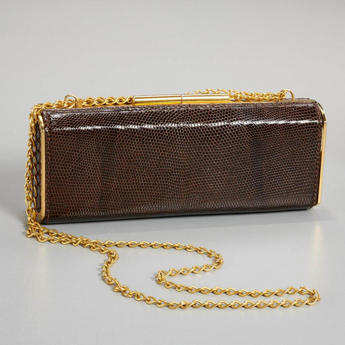 Gucci brown lizard clutch minaudiere: Gucci brown lizard clutch minaudiere, c. 1970's, with gold tone frame, leather lining, chain strap, gold stamp to interior "Made in Italy by Gucci", approx. 2.75"h x 7"w x 1.5"d, 9.5" strap drop (doub