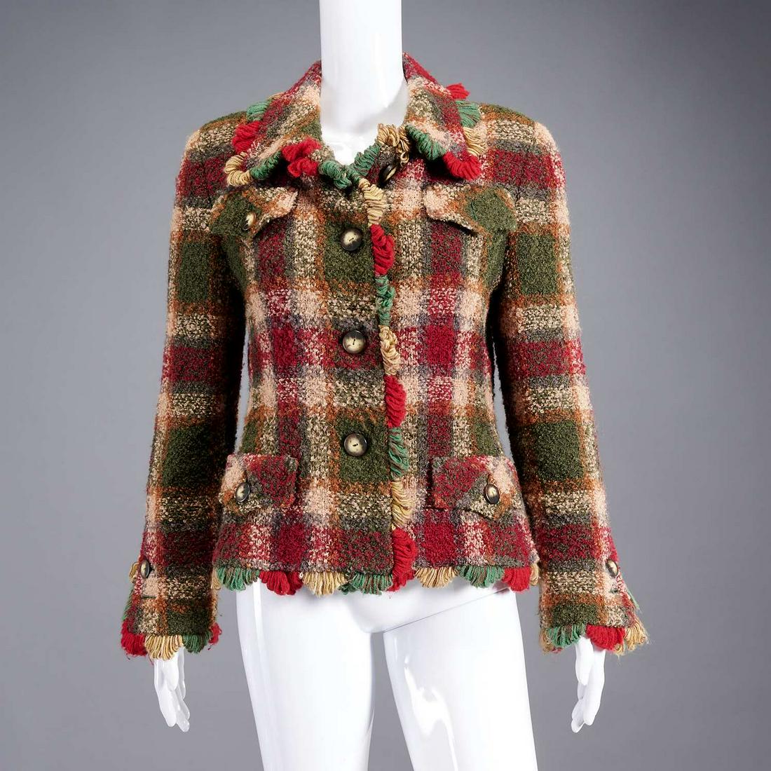 Saks Fifth Avenue boucle jacket: Saks Fifth Avenue boucle jacket, early 2000's, exclusive design in style of Chanel, button front with (4) pockets, fringed trim, button detail to sleeve, size 10 Provenance: From a private Manhattan c