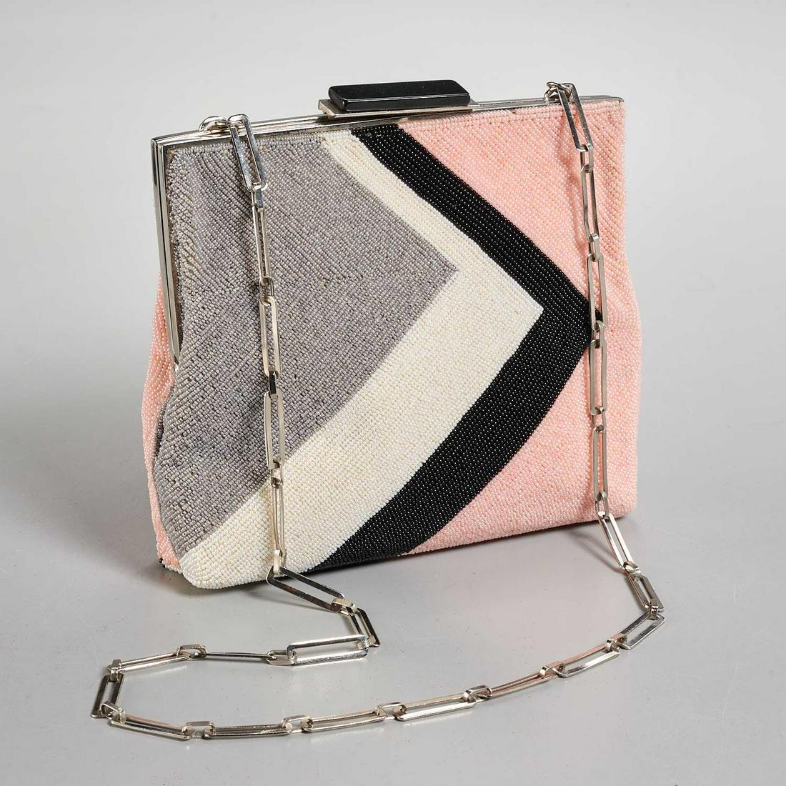 Vintage Pierre Cardin micro beaded handbag: Vintage Pierre Cardin micro beaded handbag, c. 1960's, black, pink, gray & white geometric design, silver frame with attached chain link shoulder strap, onyx closure, satin lined with (2) interior sla