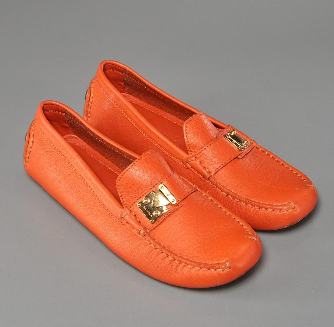 Louis Vuitton ladies orange driving loafers: Louis Vuitton ladies orange driving loafers, late 20th c., in epi leather with name engraved "Louis Vuitton" gold lock buckle, grooved rubber soles, size 35 (US 5)