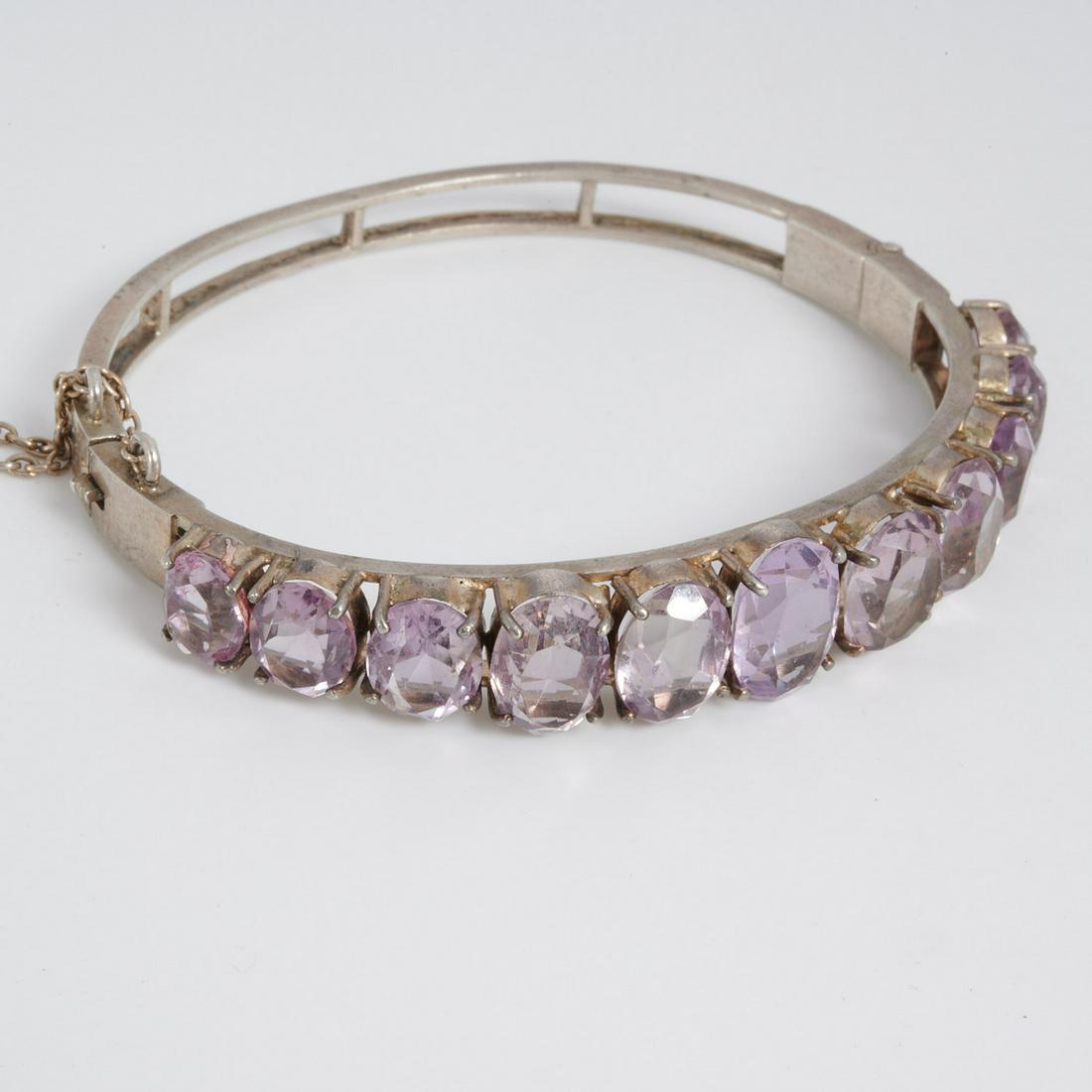 Carl August Hedblom silver & amethyst bracelet: Carl August Hedblom silver & amethyst bracelet, Stockholm, 1893, hinged with safety chain, with (11) graduated amethysts, signed Hedblom with Swedish silver marks, fits small wrist, approx. 2.25" dia.