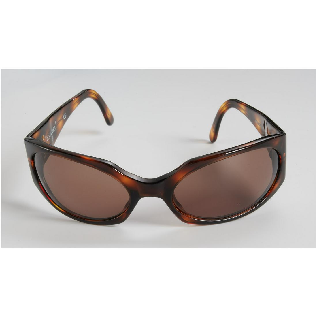 Vintage ladies Chanel tortoise sunglasses: Vintage ladies Chanel tortoise sunglasses, 20th c., rectangular shape with gold interlocking CC logo to arms, Made in Italy, numbered 07795, 91235, fits small face, approx. 6.25" across, 1.5"h
