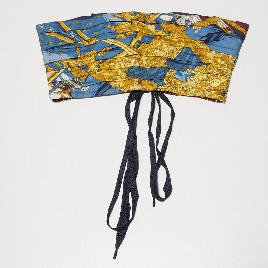 Ladies corset belt fashioned from Hermès scarf: Ladies corset belt fashioned from Hermès scarf, 20th c., using "Vue du Carosse de la Galere" print silk scarf in blues, burgundy & gold, Grygkar design first issued in 1953, approx. 7"h x 13.5" a