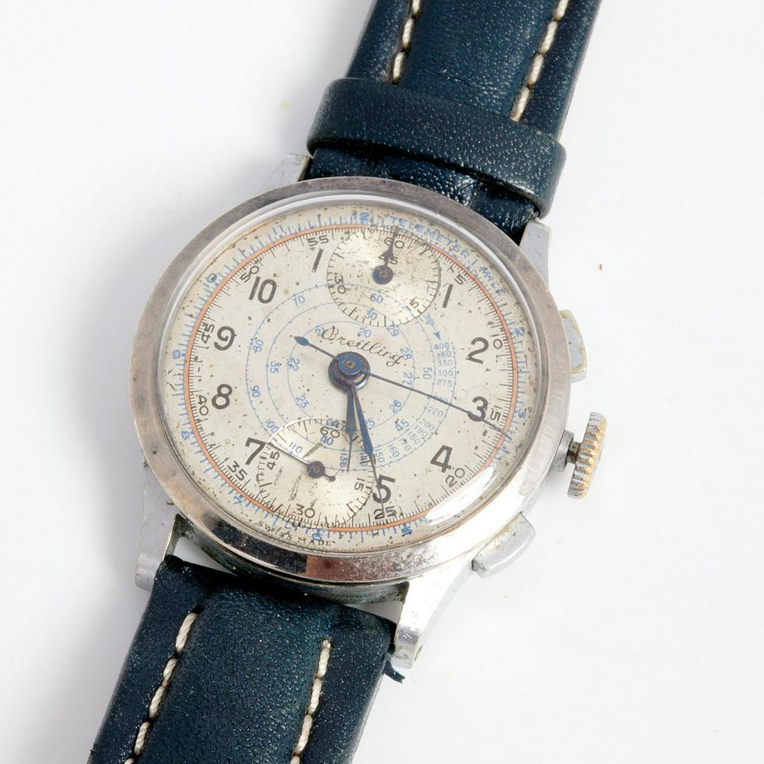 Breitling Montbrillant chronograph watch: Breitling Montbrillant chronograph watch, 1940, featuring original famous aviation slide rule, serial #37556, inscribed BPEW 1940 to case back