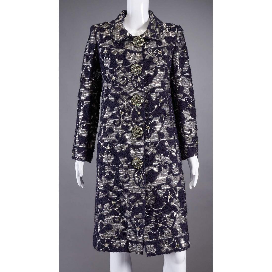 Oscar de la Renta embellished boucle coat: Oscar de la Renta embellished boucle coat, 2007 Fall Collection, ink black with silver, dual slit pockets, concealed snap closure at center front, size 10, approx. 40"b, 16"sh, 23"sl, 42"l Provenance:
