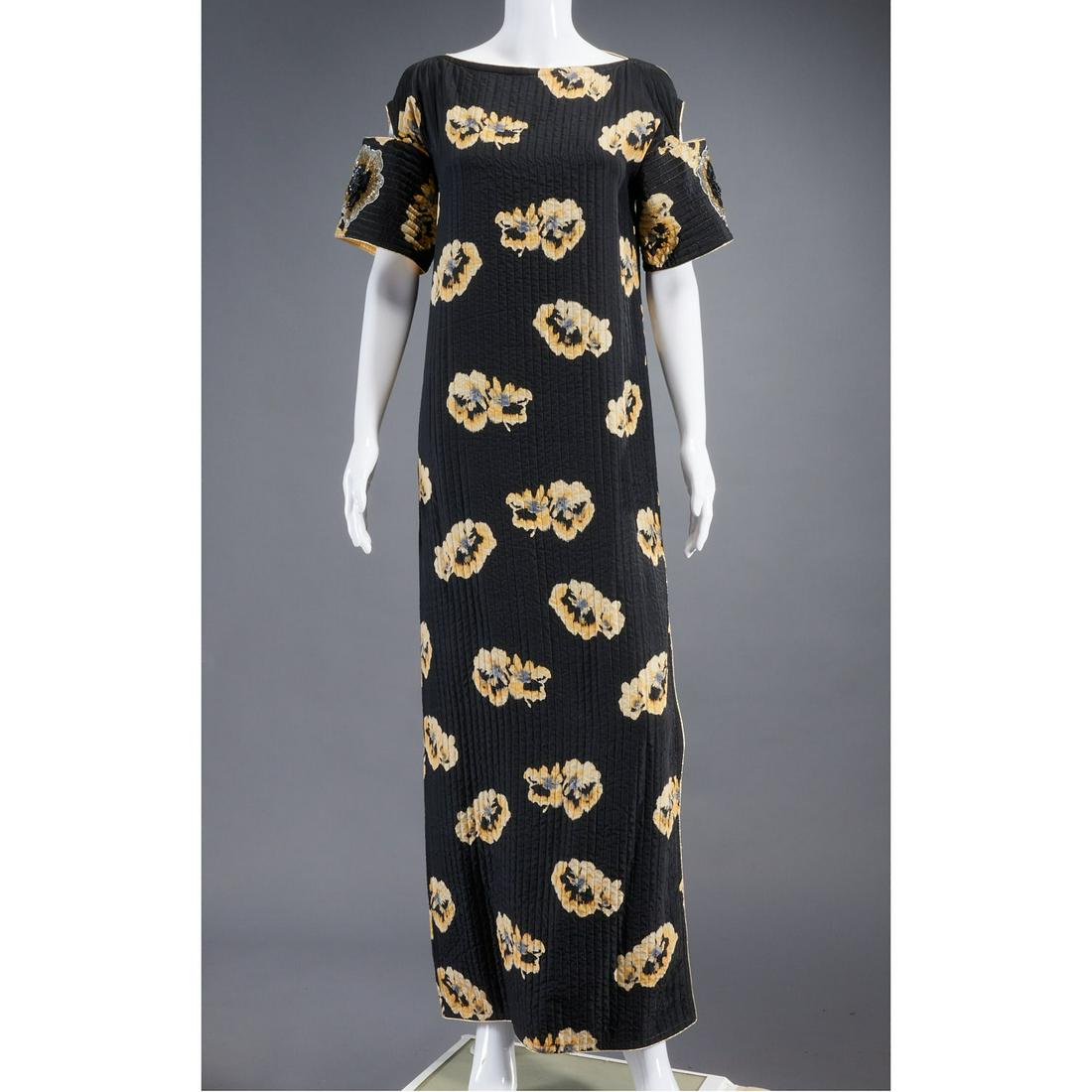 Geoffrey Beene flower print long dress: Geoffrey Beene flower print long dress, c. 1980's, retailed at B. Altman, black quilted silk with yellow flowers, metallic stitching and embroidered sequin flowers at sleeve hem, "cold shoulder" sleev