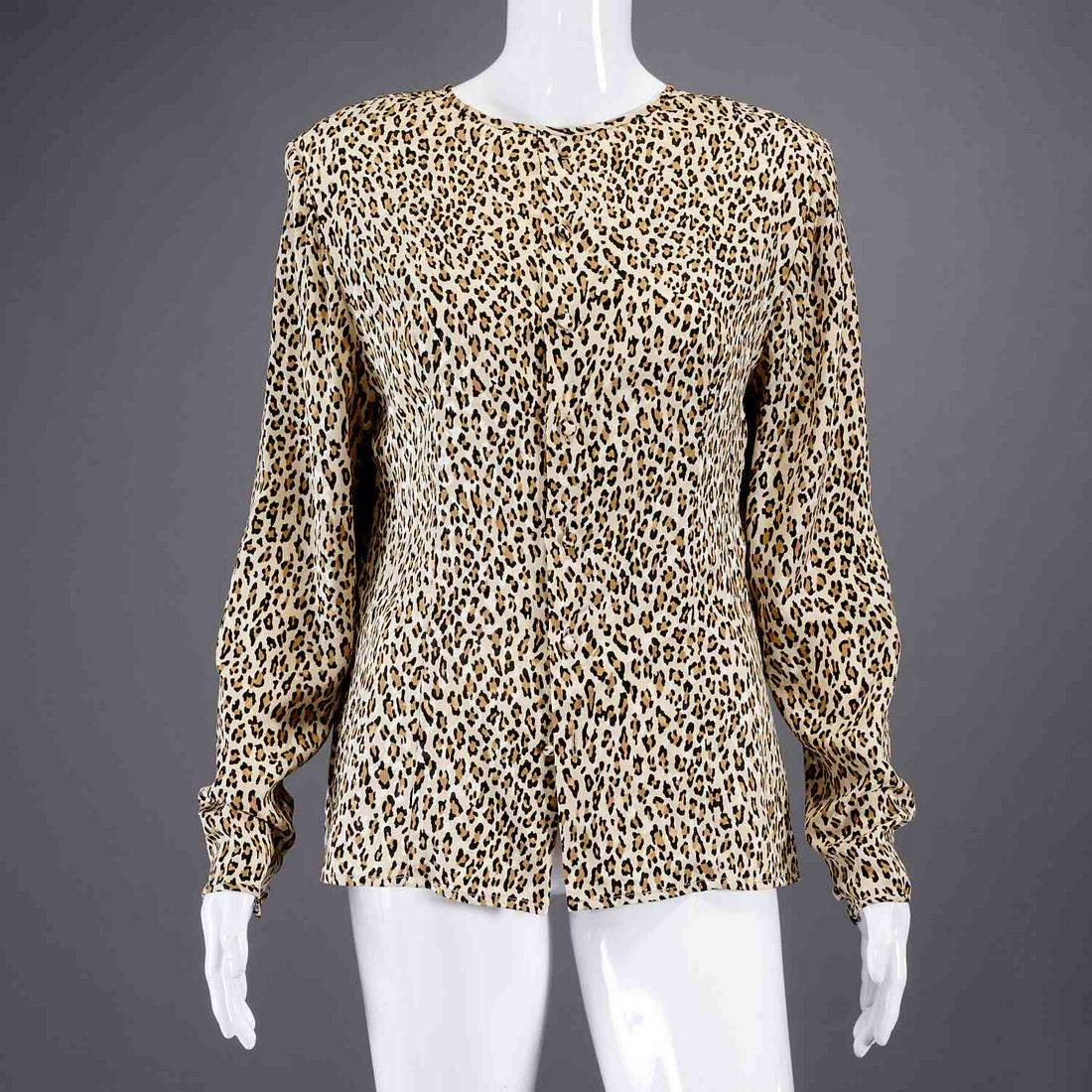 Bill Blass animal print blouse: Bill Blass animal print blouse, c. 1980's, silk button back style, jewel neckline, button sleeve detail, size 16, approx. 44"b, 24"l, 26"sl Provenance: From a private Manhattan collection