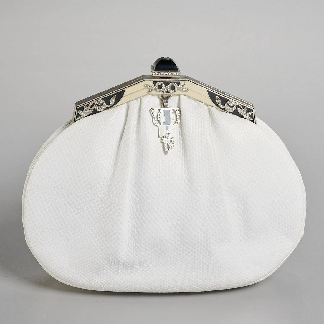 Judith Leiber white lizard handbag: Judith Leiber white lizard handbag, late 20th c., with silver hardware, clasp in black & white enamel with crystals, satin interior with slip pocket, Judith Leiber plaque, with mirror & comb, removabl