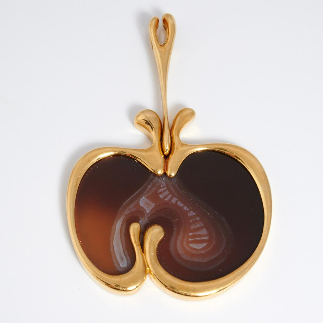 Manner of Angela Cummings carved pendant 18k gold: Manner of Angela Cummings carved pendant 18k gold, 20th c., cored apple form in agate (?) framed in modernist style gold outline, with illegible makers mark and stamped 750, approx. 4"h x 2.75"w, 53 d