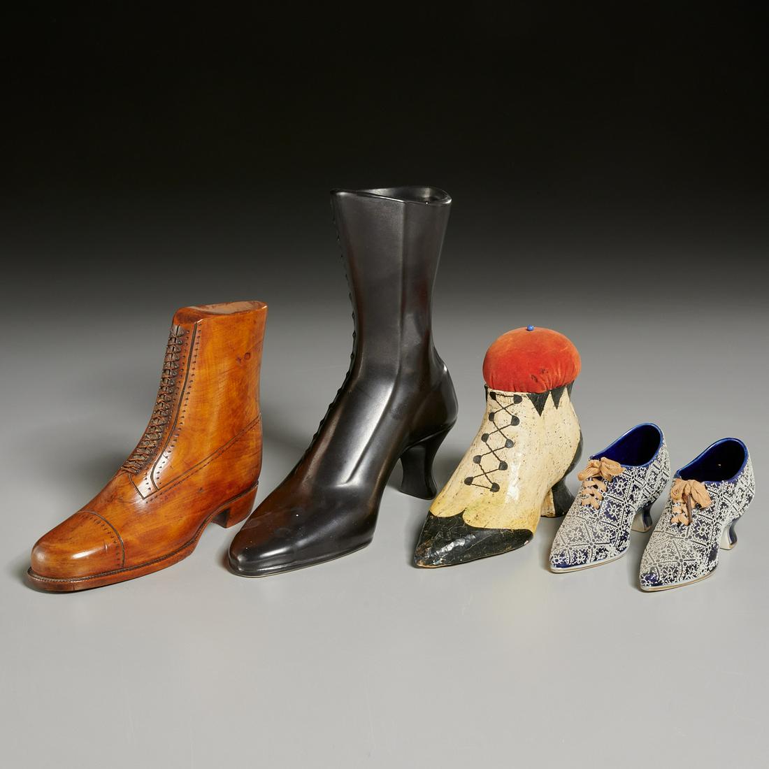 Collection Victorian-style shoe models: Collection Victorian-style shoe models, 19th/20th c., including a 19th c. papier mache and velvet pin-cushion, a Red Wing Pottery vase, a nice Folk Art carved wood boot, and a pair of Continental porc