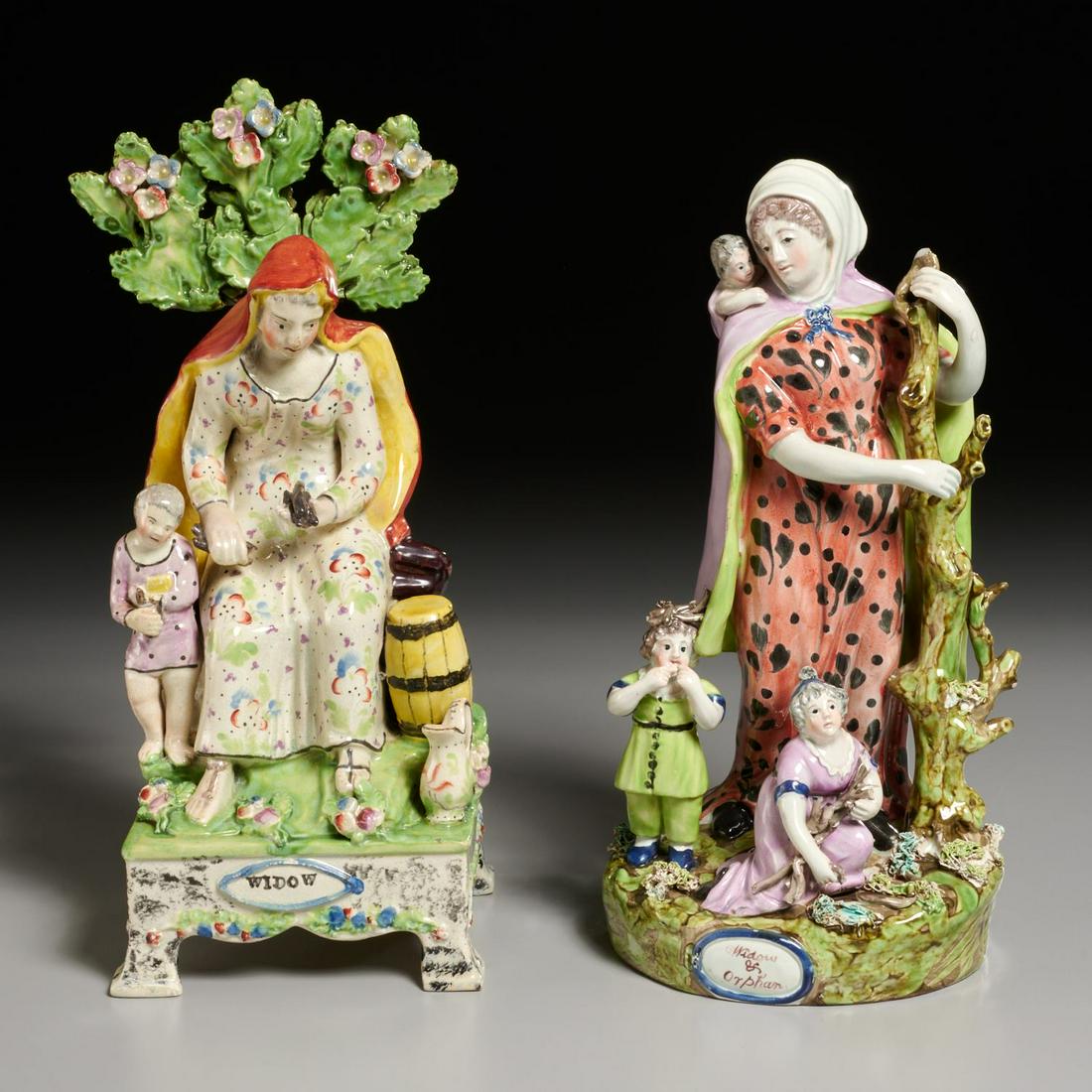 (2) Staffordshire pearlware figures of widows: (2) Staffordshire pearlware figures of widows, c. 1820, England, polychrome enameled pottery, one depicting the tale of Zarephath, seated by a barrel of meal and a jug of oil, her son by her side, an