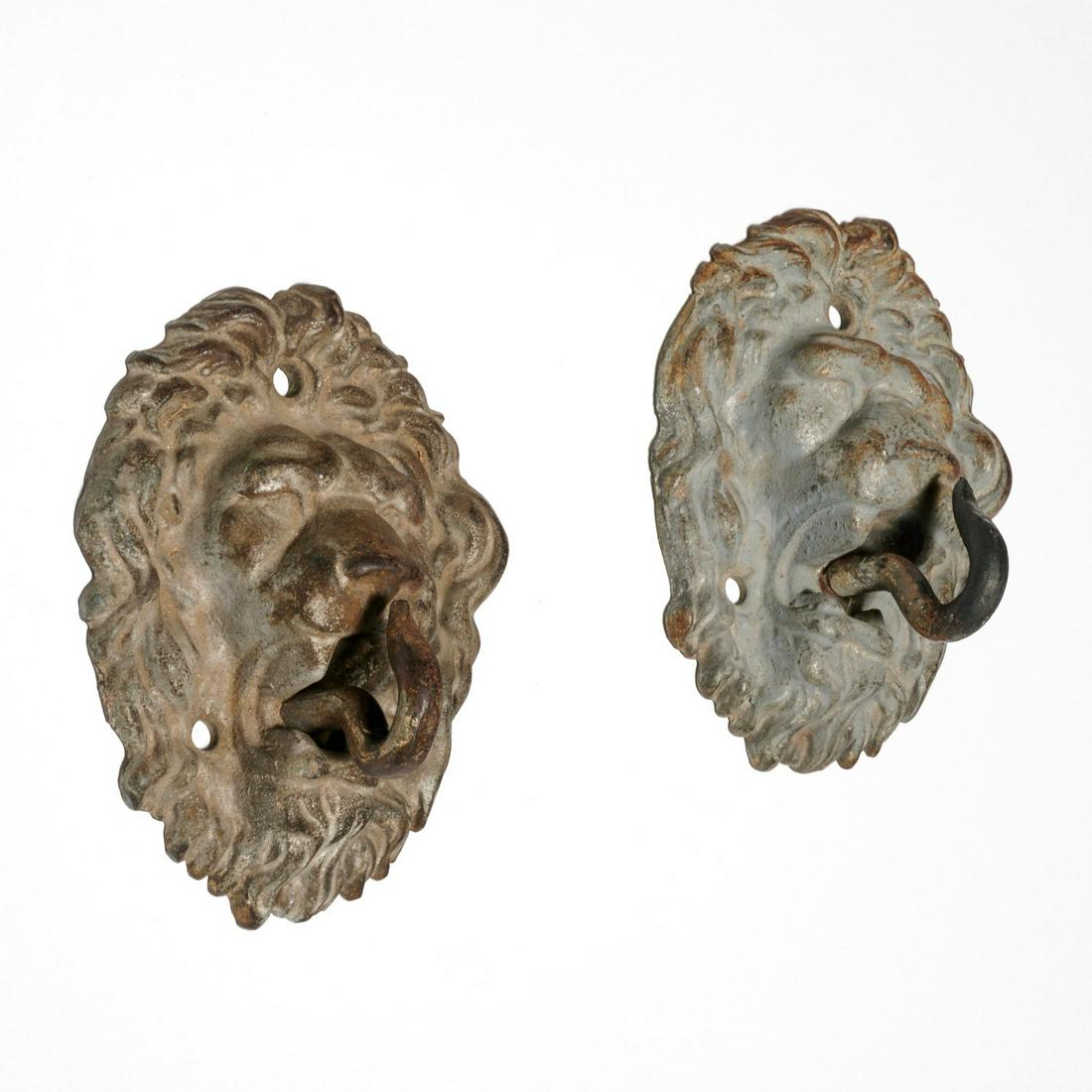 Pair cast zinc lions head hooks or tiebacks (1 of 4)