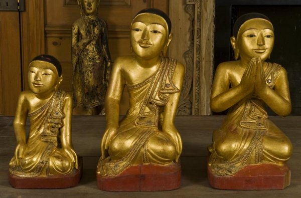 (3) Burmese glass inlaid giltwood monks: (3) Burmese glass inlaid giltwood monks, 20th Century, larger: 21"h x 9.5"w x 11"d, smaller: 15"h x 8"w x 9"d Provenance: The Doris Duke Foundation
