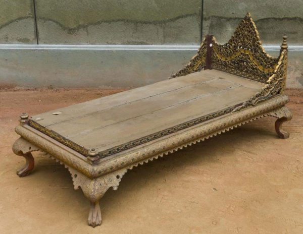 Antique Southeast Asian giltwood child's bed: Antique Southeast Asian giltwood child's bed, 19th Century, probably Thai, with elaborate pierced and mirror inlaid headboard on claw-and-ball feet, 28.5"h x 27"w x 57"l Provenance: The Doris Duke Fou