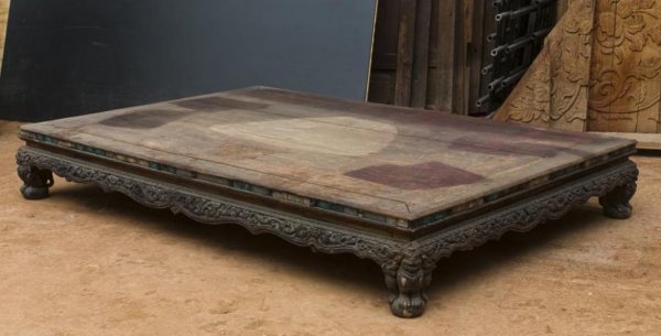 Antique Thai carved and mirror inlaid wood reclini: Antique Thai carved and mirror inlaid wood reclining platform, 18th/19th Century, the rectangular top with mirror tiled edge and carved skirt on Buddhist lion and ball feet, 13"h x 86"l x 58"w Provena