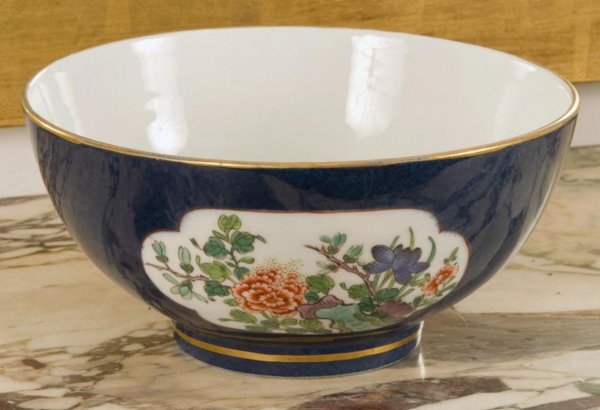 Chinese powder blue glazed bowl: Chinese powder blue glazed bowl, 20th Century, with floral decorated panels, 4.25"h x 8.75"dia. Provenance: The Doris Duke Charitable Foundation