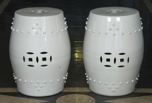 Pair antique Chinese porcelain garden seats: Pair antique Chinese porcelain garden seats, 19th/20th Century, of studded barrel form glazed in white, 20"h x 14"dia. Provenance: The Doris Duke Charitable Foundation