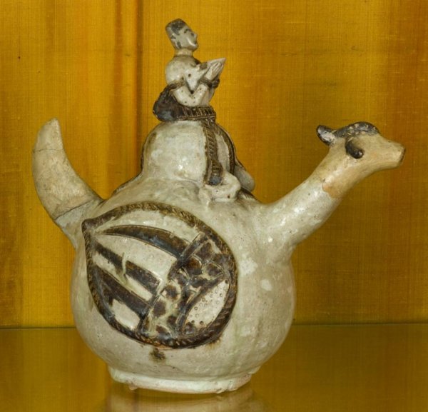 Antique Sawankhalok stoneware Hamsa vessel: Antique Sawankhalok stoneware Hamsa vessel, Probably 15th Century, Thailand, with figural finial, tail handle and goose neck spout, 9.75"h x 10.5"l x 6"w Provenance: The Doris Duke Foundation