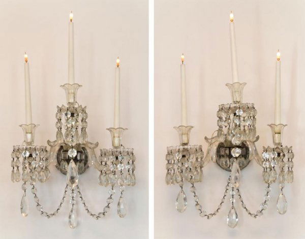 Set (4) antique Anglo-Irish crystal wall sconces: Set (4) antique Anglo-Irish crystal wall sconces, 19th Century, fitted later for electricity, each composed of 3 S-scrolled candle branches hung with prism chains and tear-shaped drops, 18"h x 15"w x
