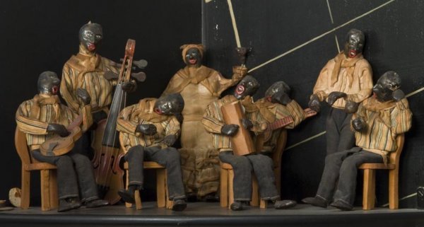 Composition and cloth model of an African-American: Composition and cloth model of an African-American jazz band, Early 20th Century, the 8-piece band with musicians and female singer, largest: 10"h x 4"w Provenance: The Doris Duke Charitable Foundatio