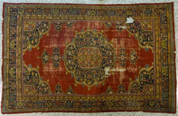 Antique Turkish carpet: Antique Turkish carpet, The tomato red field with central medallion within green, blue and salmon border stripes, approx. 12'6" x 8'6" Provenance: The Doris Duke Charitable Foundation