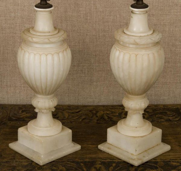 Pair Italian alabaster lamps: Pair Italian alabaster lamps, First half 20th Century, of reeded urn form on stepped base, 25"h x 5"dia. Provenance: The Doris Duke Charitable Foundation