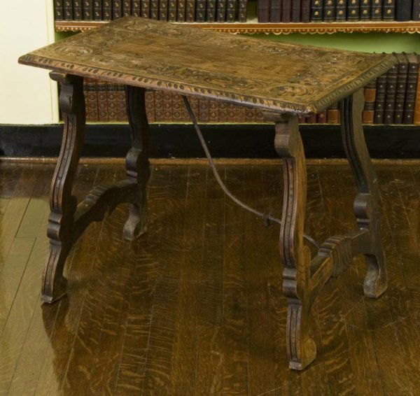 Antique Spanish Baroque style beechwood side table: Antique Spanish Baroque style beechwood side table, 19th Century, rectangular top carved with centurion heads and foliate scrolls on trestle base, 25"h x 30.75"l x 19"d Provenance: The Doris Duke Char