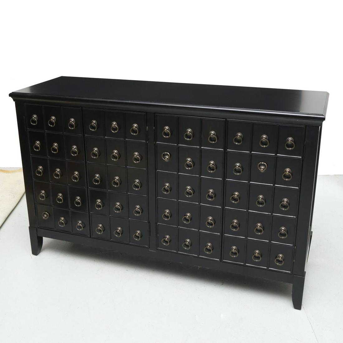 Black lacquered four door "Apothecary" sideboard: Black lacquered four door "Apothecary" sideboard, 21st c., each door front faced as drawers with brass-tone handles, recalling an antique apothecary cabinet, opening to a fixed shelves, on shaped legs
