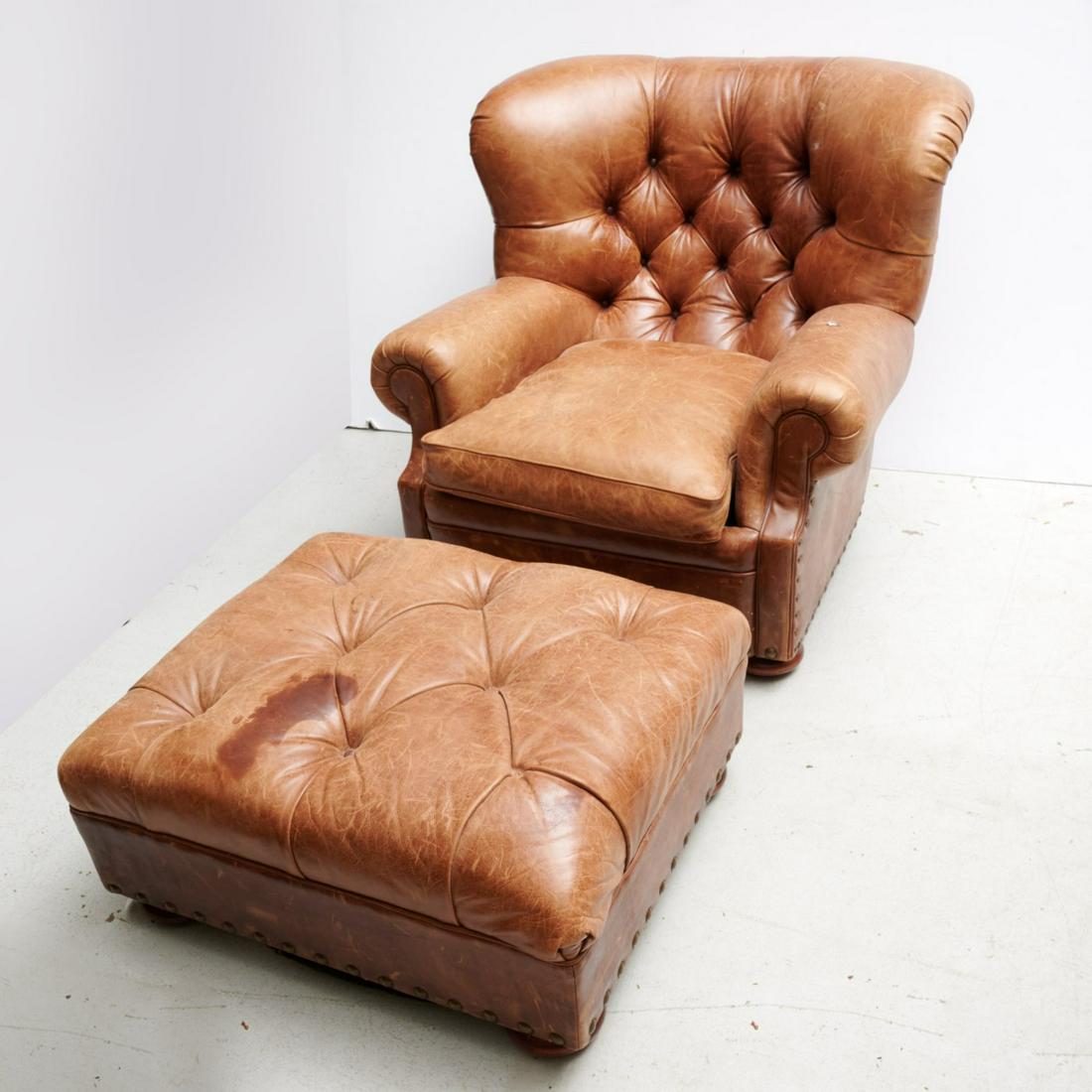 Ralph Lauren leather club chair and ottoman: Ralph Lauren leather club chair and ottoman, 20th/21st c., with oversized nail head trim along, labeled under seat cushion, 36"h x 40"w x 40"d (chair), 17"h x 32"w x 26.5"d (ottoman)