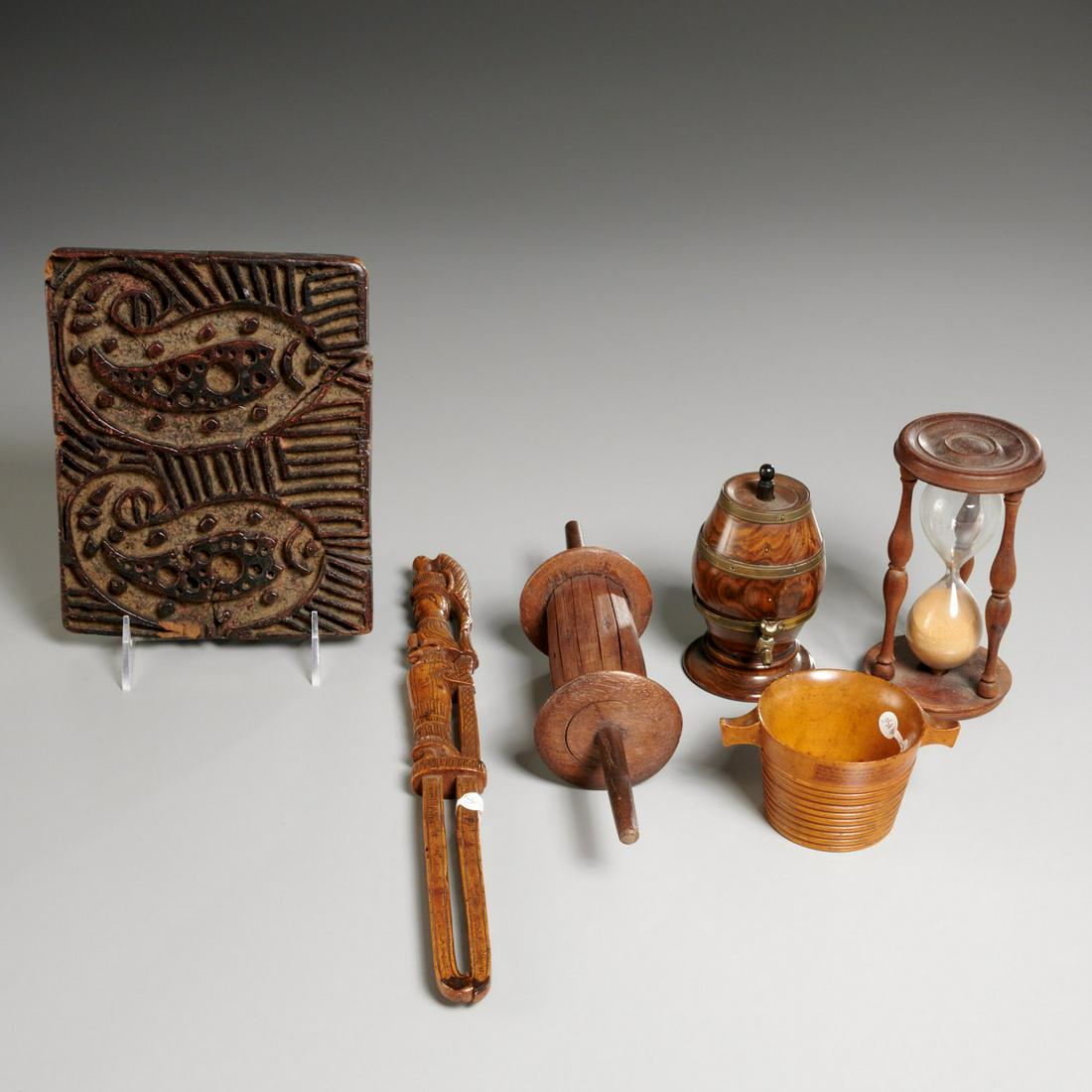 Antique and Folk woodenware group: Antique and Folk woodenware group, Mostly 19th c., (6) pieces incl. a beer cask string dispenser, spindle, double fish mold, wood and glass hourglass, Scottish turned wood cup, and a carved figural st