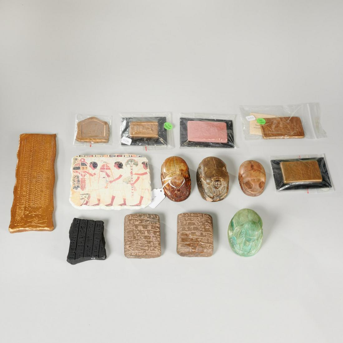 Group ancient scarab & tablet replicas, ex-museum: Group ancient scarab & tablet replicas, ex-museum, Incl. (4) Egyptian scarabs and (10) tablet reproductions, examples incl. Assyrian and Babylonian, 4.5"h x 6"w (largest), smallest: 2.5"squ. (smallest