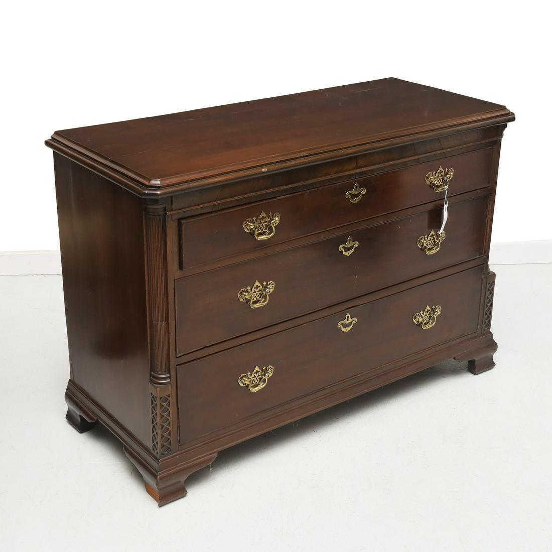 George III mahogany chest of drawers: George III mahogany chest of drawers, 19th c., three graduated drawers, flanked by fluted quarter columns and blind fretted panels, on ogee brackets, approx. 34"h x 24"h x 20.5"d Provenance: Property 