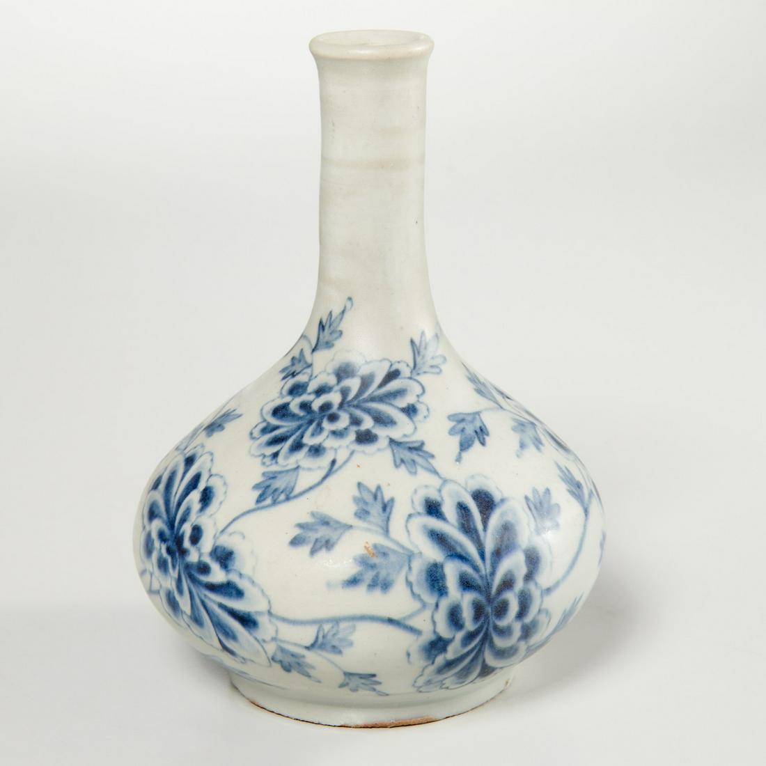 Korean porcelain blue and white bottle vase: Korean porcelain blue and white bottle vase, 19th c., Choson Dynasty, bulbous body with slender cylindrical neck ending in rolled lip, painted in underglaze blue with blossoming peonies, sticker label