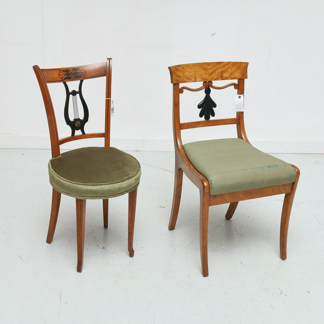 (2) Biedermeier fruitwood side chairs u: (2) Biedermeier fruitwood side chairs u, 19th c., incl. one with carved lyre back, and the other with foliate back splat, each parcel ebonized, and with green upholstered seat cushion, 33.5"h x 15.5 (