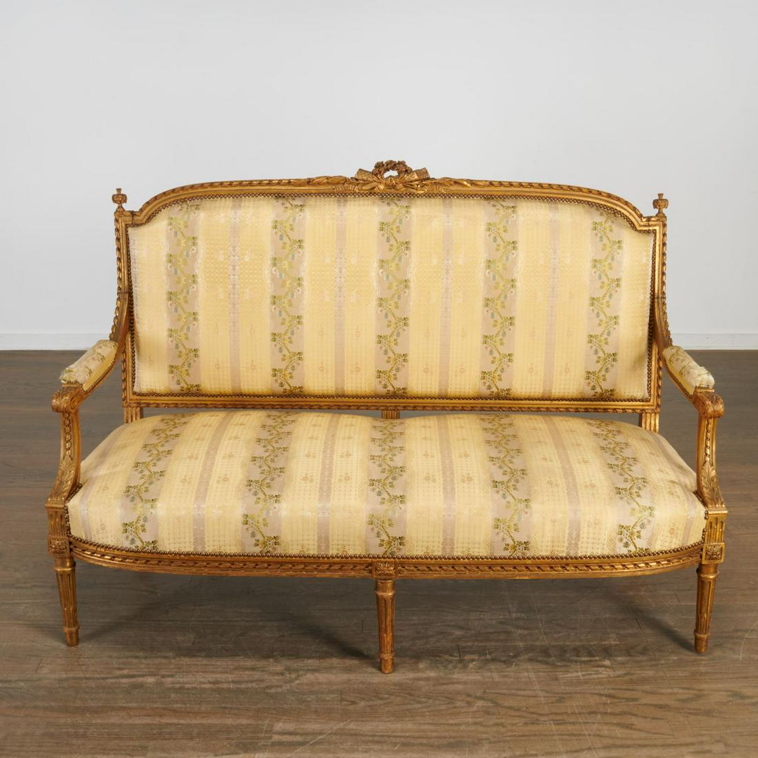 Louis XVI style silk and giltwood canape: Louis XVI style silk and giltwood canape, 19th c., France, the sofa with intricately carved scroll ribbon frame, the top rail decorated with wreath and arrow crest and finials, acanthus carved arms, t