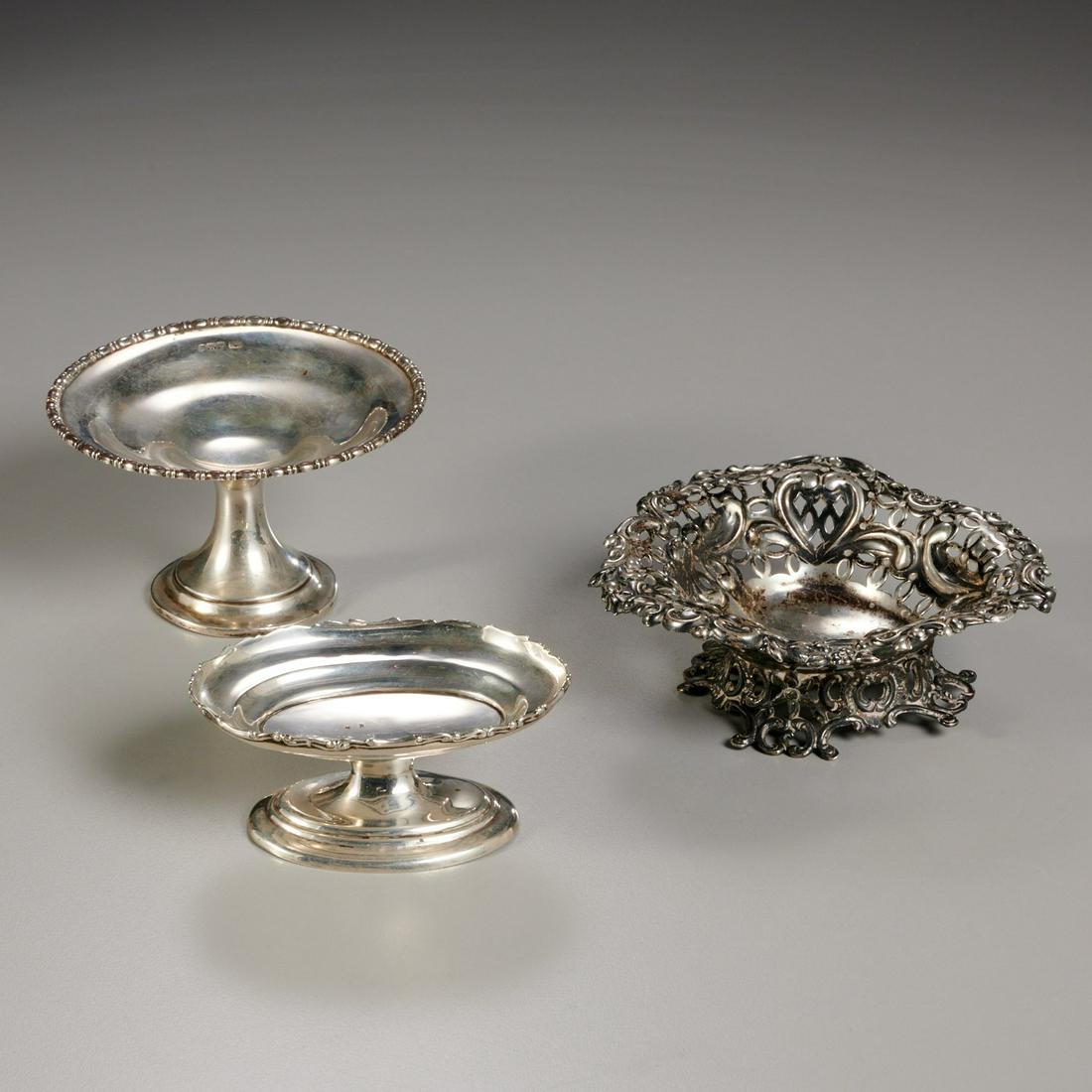(3) small English silver footed dishes: (3) small English silver footed dishes, 19th/20th c., England, including a Victorian pierced and reticulated heart shaped dish, mark of William Comyns, 1893, 2"h x 4.5"l x 4"w, together with an oval a