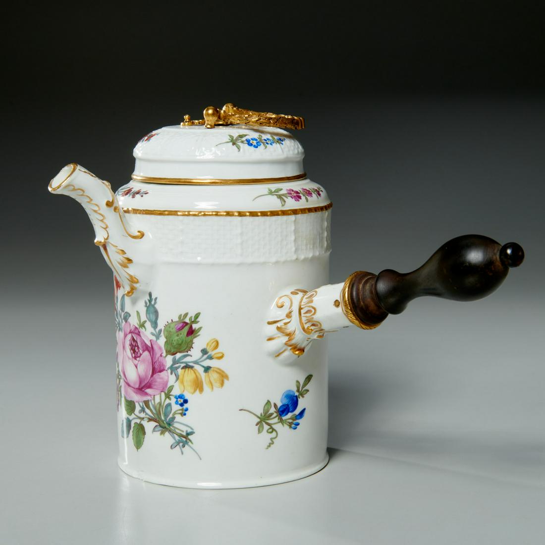 Meissen hand painted porcelain chocolate pot: Meissen hand painted porcelain chocolate pot, Meissen (likely 18th c.), hand painted floral decorated porcelain hot chocolate pot, with turned wood handle, gilt metal lid handle, faint dot of blue und