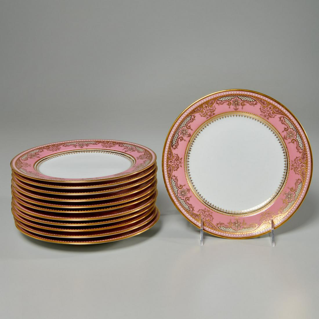 Set (12) Spode Copeland pink banded gilt plates: Set (12) Spode Copeland pink banded gilt plates, 20th c., English, porcelain dessert or salad plates, having a pink banded border, with floral, scroll, and beaded gilt decoration, and white beaded ena