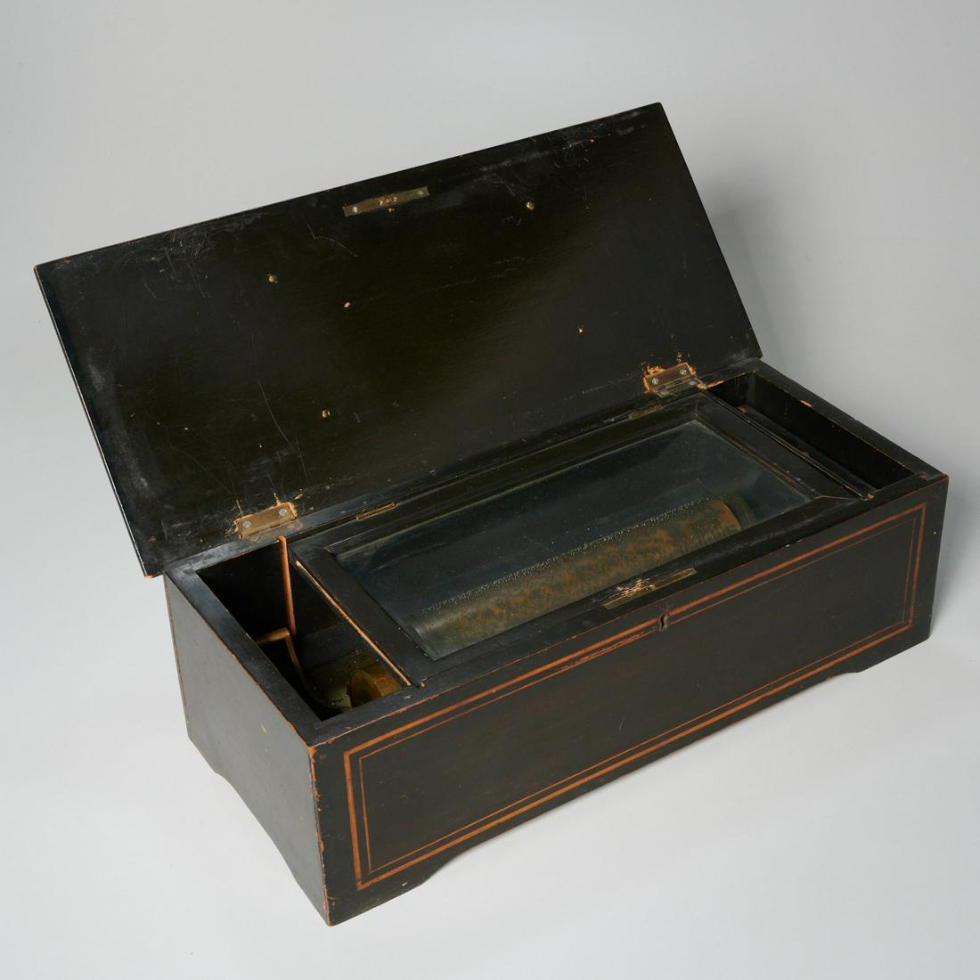 Painted hardwood cylinder music box: Painted hardwood cylinder music box, 60-note, brass cylinder, stamped "3118" on brass base, top and front with painted border, 9"l (cylinder), 5.5"h x 18"l x 7.5"d (case)