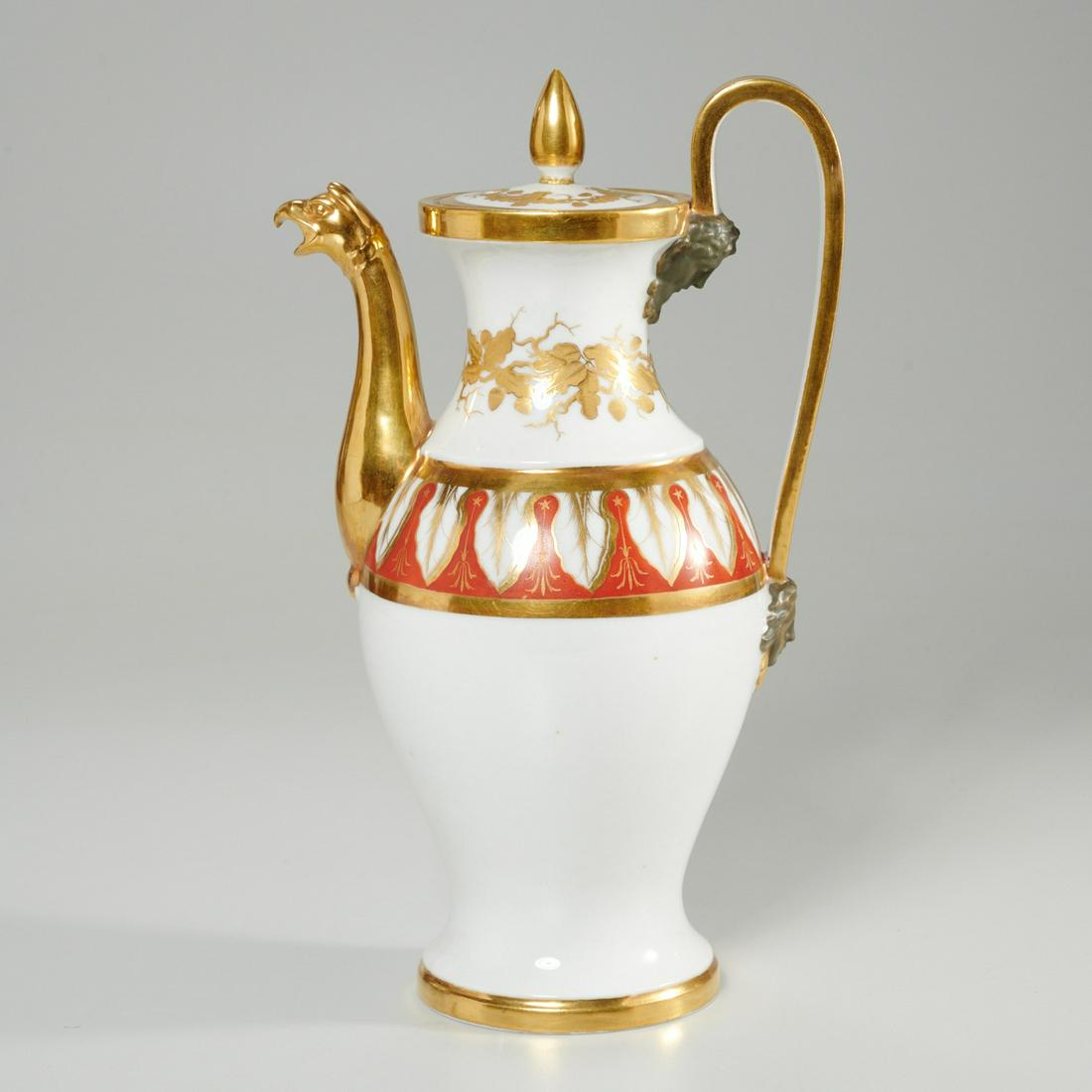 Old Paris gilt porcelain coffee pot: Old Paris gilt porcelain coffee pot, 19th c., with griffin form gilt spout, figural decorations at top and bottom of handle, unmarked, 11"h x 4.5"l x 6.75"w