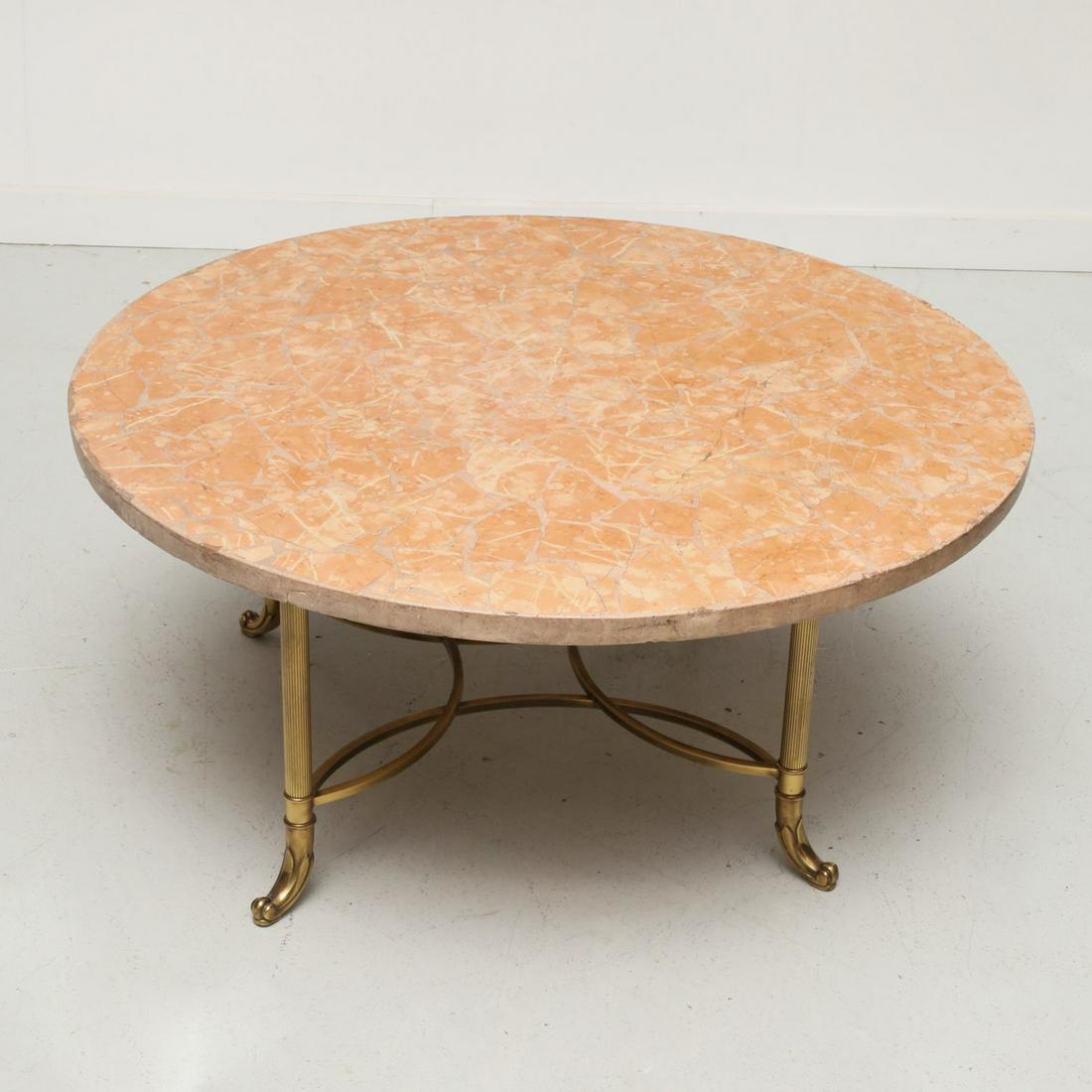 Italian marble and brass cocktail table: Italian marble and brass cocktail table, 20th c., on reeded legs ending on paw feet, with loose pink marble top, base and marble each marked "Made in Italy", 17.5"h x 36"dia.