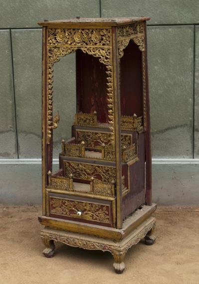 Antique Thai red painted and giltwood attachan alta: Antique Thai red painted and giltwood attachan altar, 19th century, of typical stepped form with pierced galleries on claw-and-ball feet, 51"h x 20.5"w x 18"d Provenance: Doris Duke's Southeast Asian 